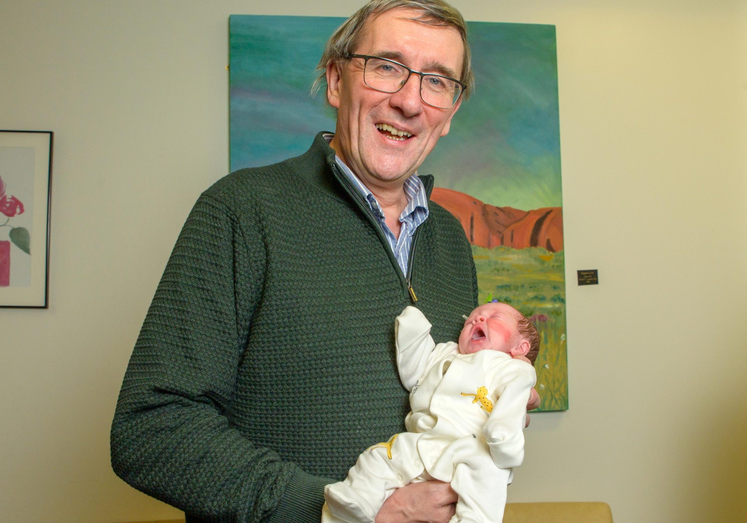 Professor Plant with baby Croía, newborn daughter of his patient Colette Hawe